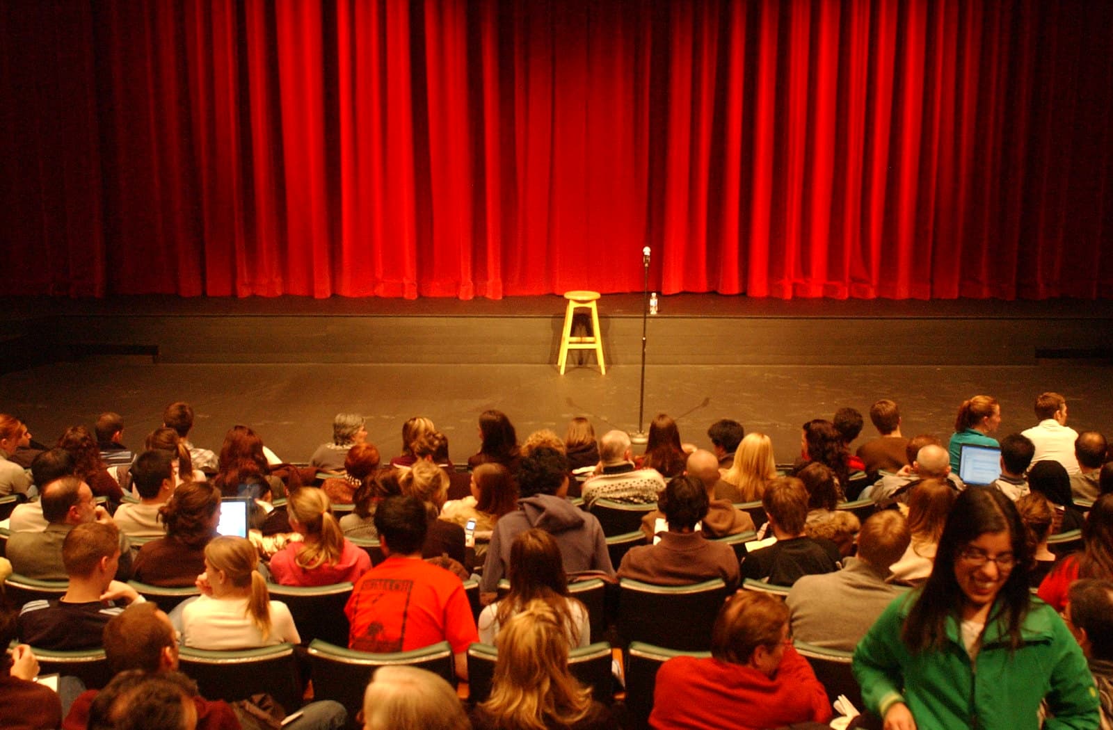 A full theater audience seated before a performance.