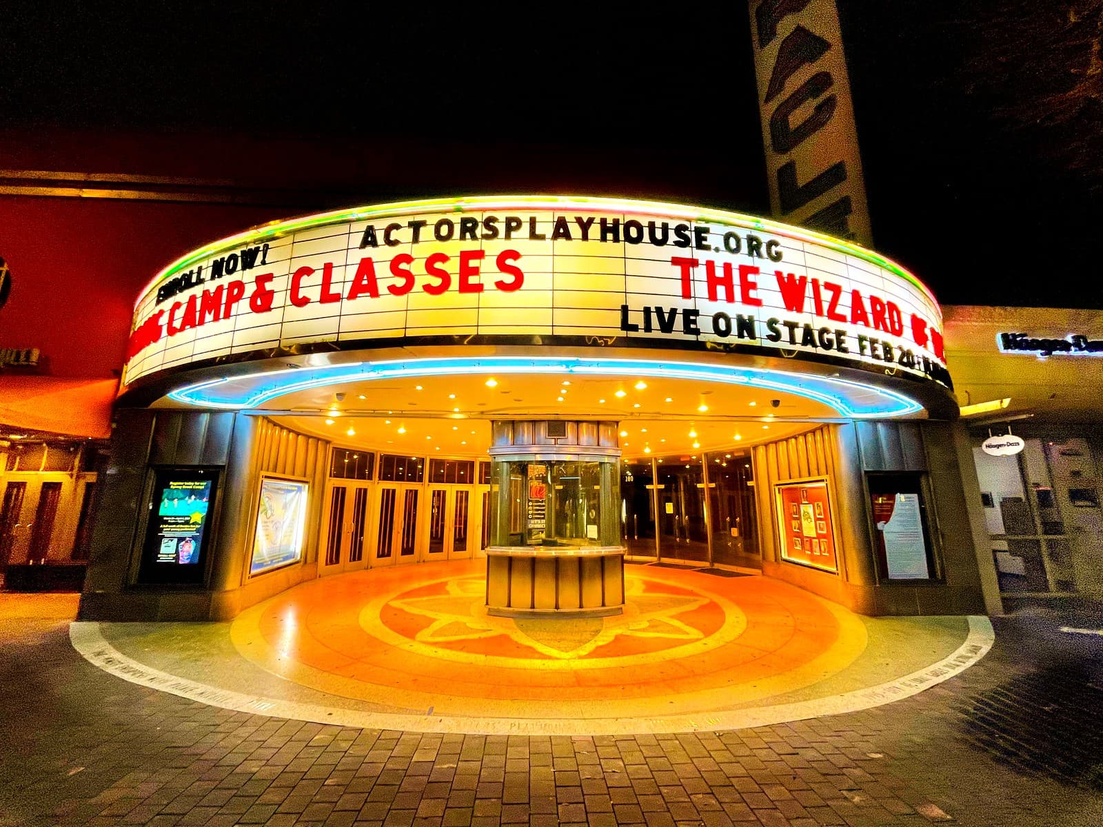 The marquee and exterior signage of a neighborhood theater.